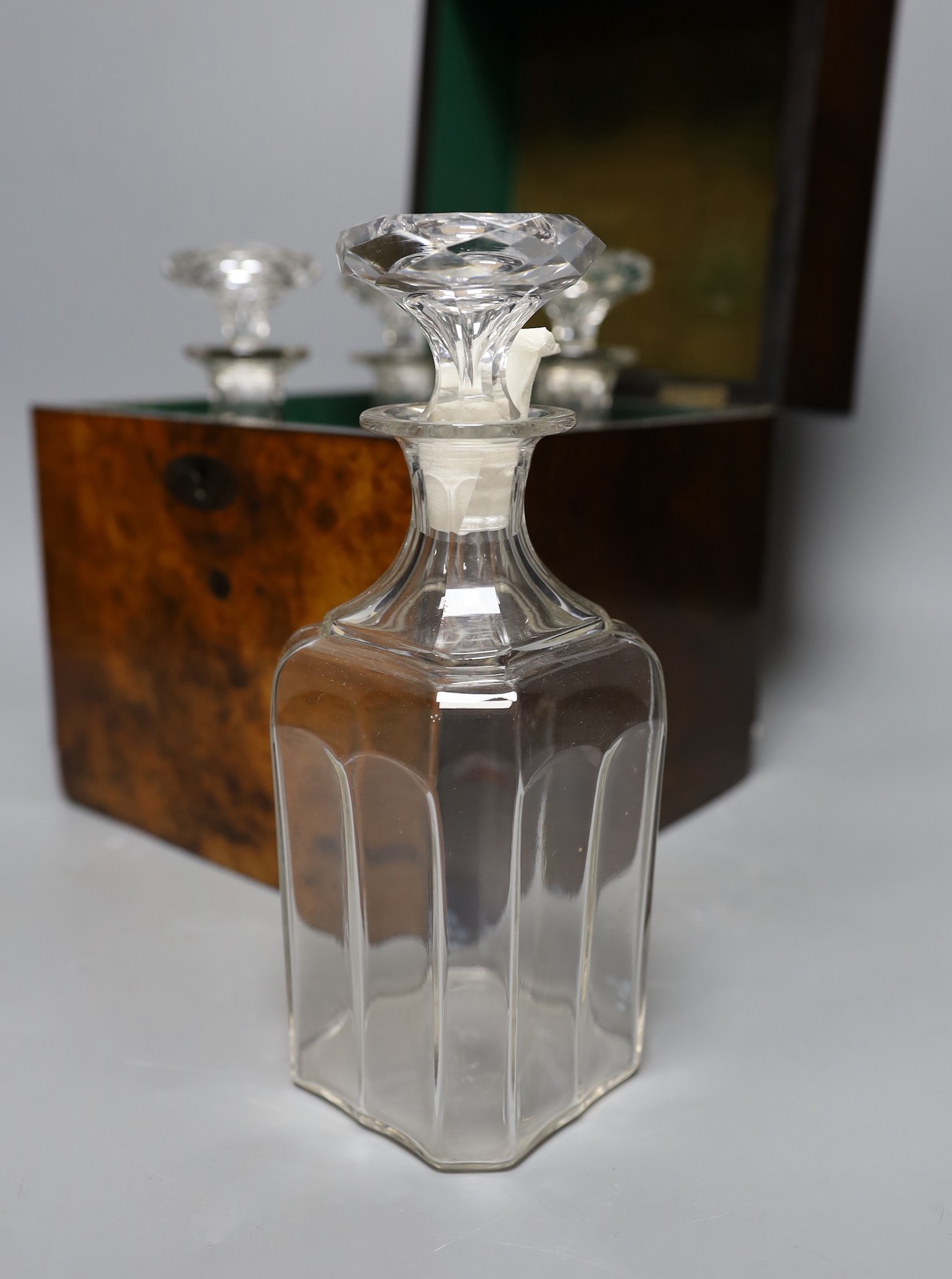 A Victorian burr walnut 4 bottle decanter box, four glass decanters and a silver ‘port’ label, 24cm high